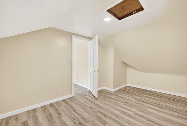 545 Vanderbilt Rd, Dunbar Twp, PA 15425 - additional living space with attic access, light wood finished floors, and vaulted ceiling