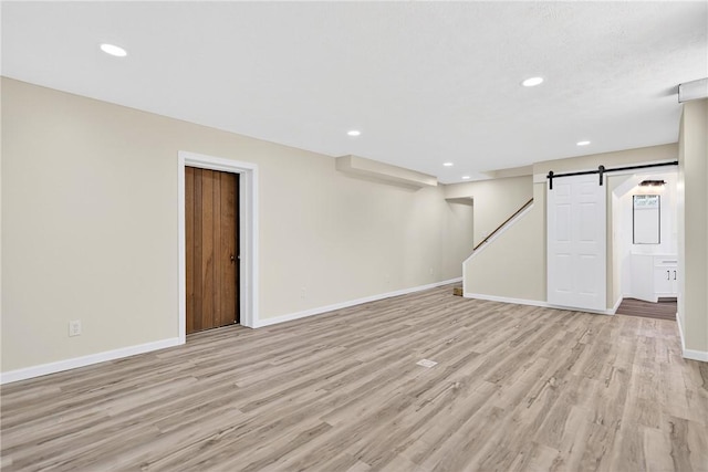 545 Vanderbilt Rd, Dunbar Twp, PA 15425 - basement featuring a barn door, light wood finished floors, recessed lighting, and stairway