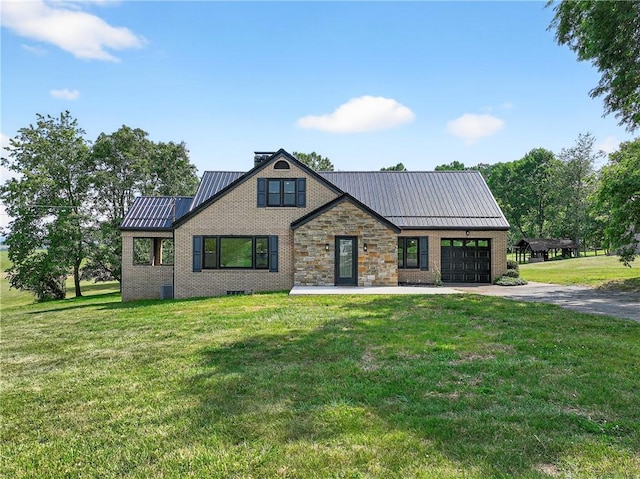 545 Vanderbilt Rd, Dunbar Twp, PA 15425 - view of front of house featuring brick siding, driveway, a metal roof, an attached garage, and a standing seam roof