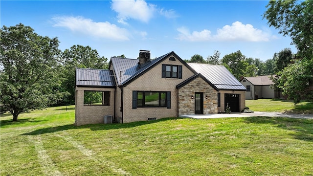 545 Vanderbilt Rd, Dunbar Twp, PA 15425 - view of front of home featuring a standing seam roof, a metal roof, brick siding, a front yard, and a chimney