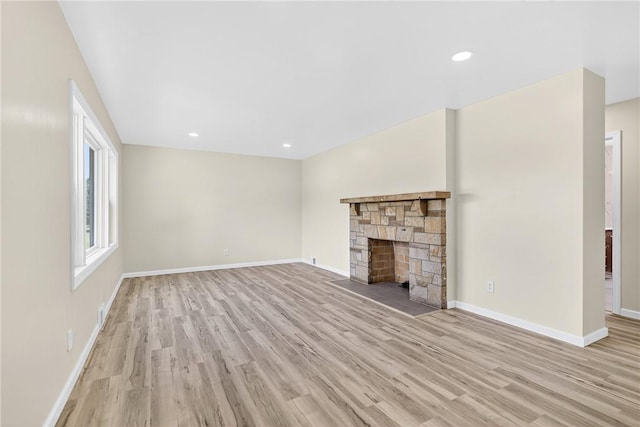 545 Vanderbilt Rd, Dunbar Twp, PA 15425 - unfurnished living room with light wood finished floors, a fireplace, and recessed lighting