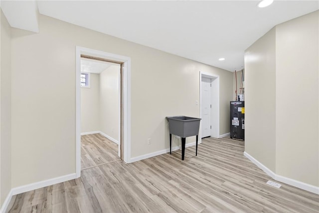 545 Vanderbilt Rd, Dunbar Twp, PA 15425 - empty room with light wood finished floors, recessed lighting, and electric water heater