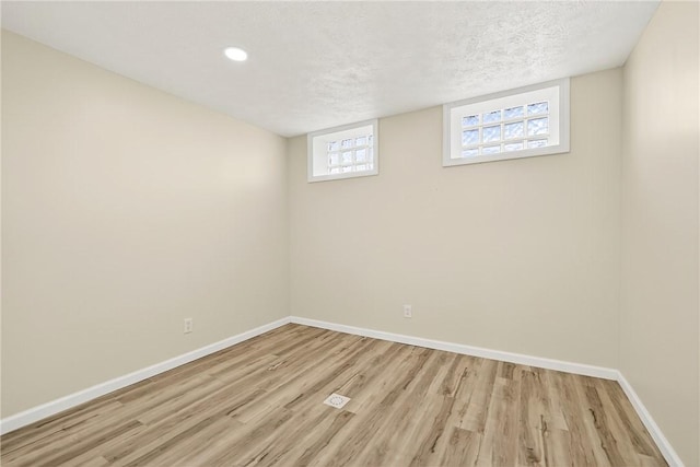 545 Vanderbilt Rd, Dunbar Twp, PA 15425 - basement with light wood-style floors, a textured ceiling, and recessed lighting