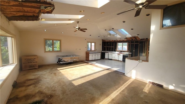 1442 Greensburg Pike, Sewickley Twp, PA 15089 - unfurnished living room featuring a skylight, ceiling fan, vaulted ceiling, and recessed lighting