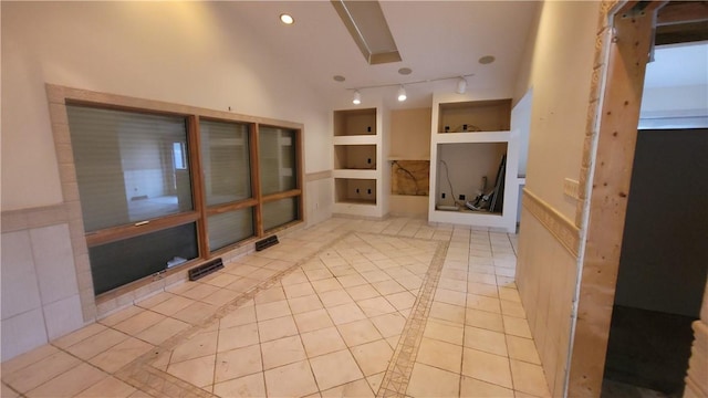 1442 Greensburg Pike, Sewickley Twp, PA 15089 - spare room with built in features, inlaid floor details, light tile patterned flooring, and lofted ceiling