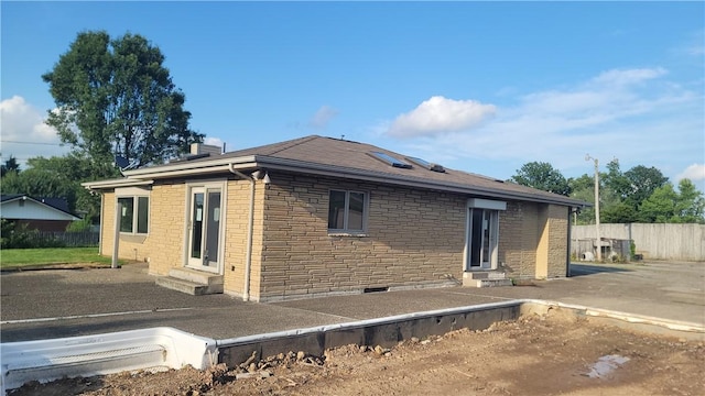 1442 Greensburg Pike, Sewickley Twp, PA 15089 - rear view of property featuring entry steps, brick siding, and a patio