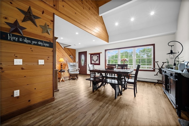 1419 Bullion Rd, Victory Twp, PA 16342 - dining area featuring wooden walls, wood finished floors, recessed lighting, lofted ceiling, and a baseboard heating unit