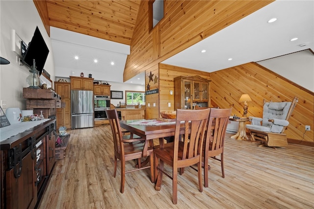 1419 Bullion Rd, Victory Twp, PA 16342 - dining space with wood walls, light wood-style flooring, high vaulted ceiling, and recessed lighting