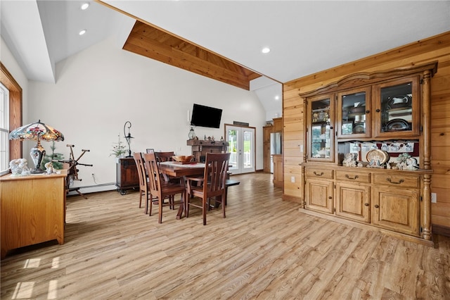 1419 Bullion Rd, Victory Twp, PA 16342 - dining room featuring light wood-type flooring, french doors, wooden walls, recessed lighting, and a baseboard radiator