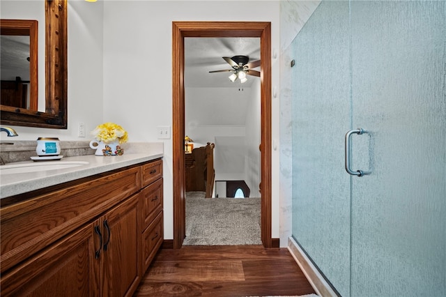 1419 Bullion Rd, Victory Twp, PA 16342 - full bathroom featuring wood finished floors, vanity, a shower stall, and a ceiling fan