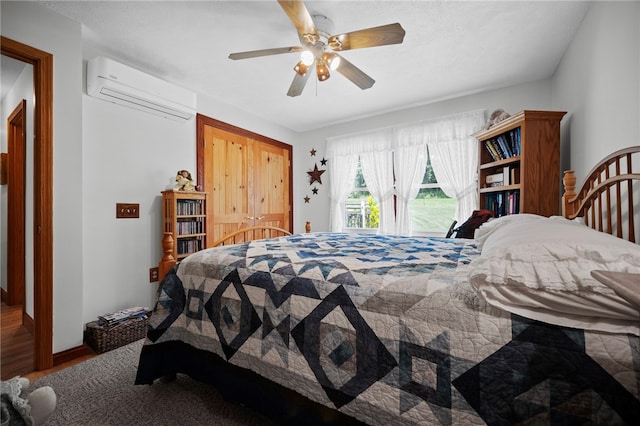 1419 Bullion Rd, Victory Twp, PA 16342 - bedroom with wood finished floors, a wall mounted air conditioner, and a ceiling fan