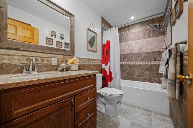 1419 Bullion Rd, Victory Twp, PA 16342 - full bathroom with vanity, shower / bath combo, tile walls, a textured ceiling, and recessed lighting