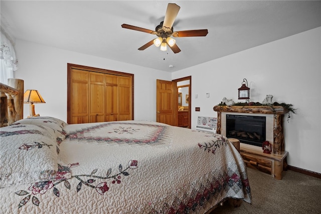 1419 Bullion Rd, Victory Twp, PA 16342 - carpeted bedroom with a glass covered fireplace, a ceiling fan, and a closet