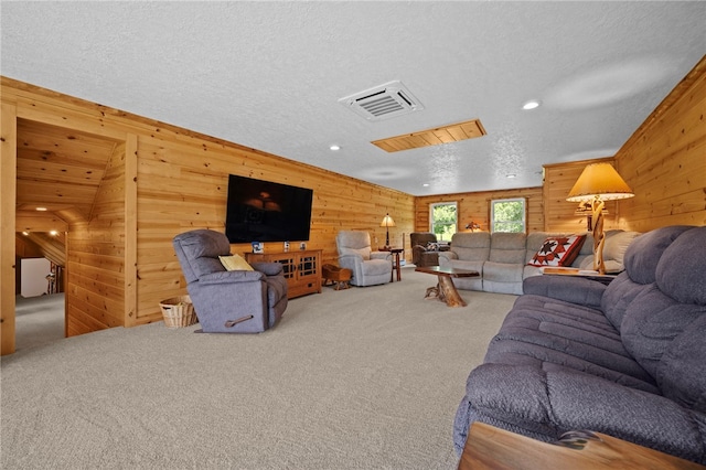 1419 Bullion Rd, Victory Twp, PA 16342 - carpeted living area featuring wooden walls, a textured ceiling, and recessed lighting