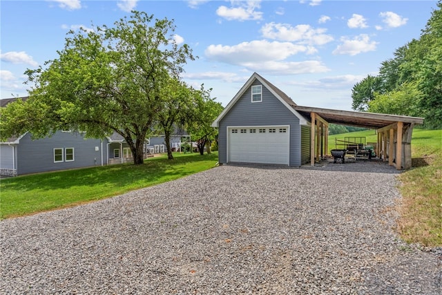 1419 Bullion Rd, Victory Twp, PA 16342 - view of front of house featuring a front yard, an outbuilding, driveway, and a detached garage