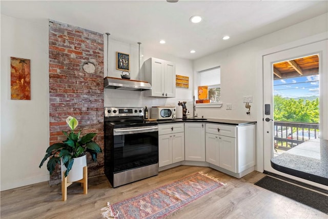 2212 Freeport Rd, Harmar, PA 15238 - kitchen featuring stainless steel appliances, light wood-style flooring, ventilation hood, white cabinets, and recessed lighting