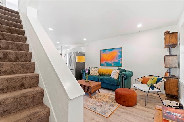 2212 Freeport Rd, Harmar, PA 15238 - living area with wood finished floors, stairway, and recessed lighting