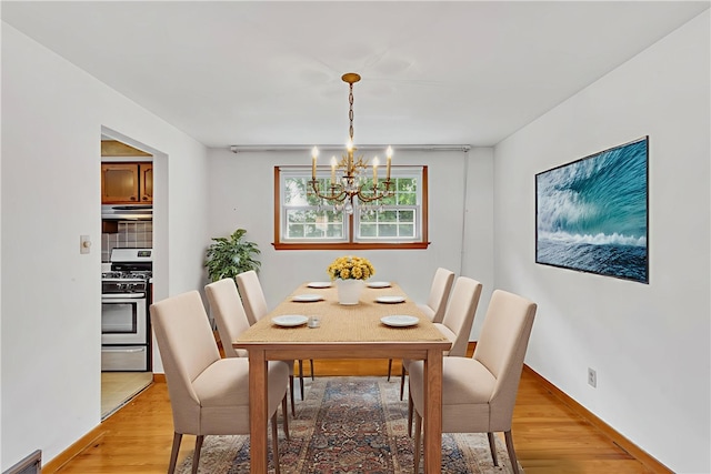 428 Englewood Dr, Ross Twp, PA 15237 - dining area with a chandelier and light wood-style floors
