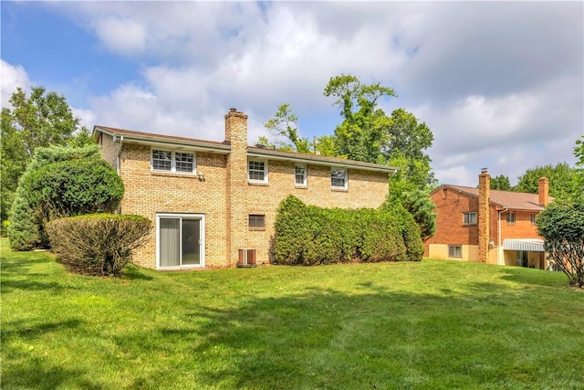 428 Englewood Dr, Ross Twp, PA 15237 - back of house featuring brick siding, a yard, and a chimney