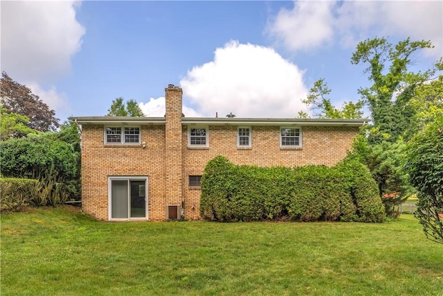 428 Englewood Dr, Ross Twp, PA 15237 - back of house with brick siding, a chimney, and a lawn