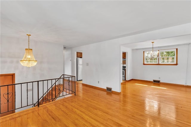 428 Englewood Dr, Ross Twp, PA 15237 - unfurnished room featuring a chandelier and light wood finished floors