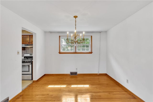 428 Englewood Dr, Ross Twp, PA 15237 - unfurnished dining area featuring a chandelier and light wood-style floors