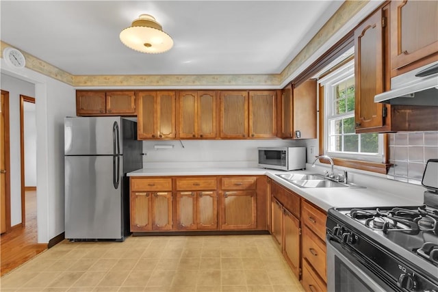428 Englewood Dr, Ross Twp, PA 15237 - kitchen featuring appliances with stainless steel finishes, light countertops, and brown cabinets
