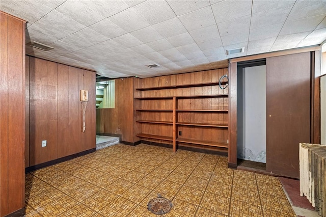 4614 Carroll St, Bloomfield, PA 15224 - finished basement with wooden walls and tile patterned floors