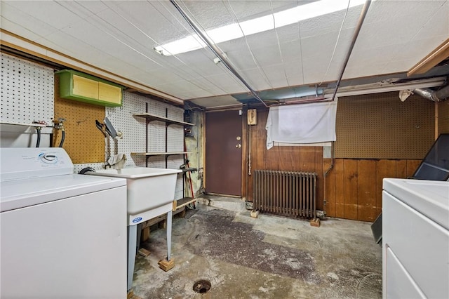 4614 Carroll St, Bloomfield, PA 15224 - laundry room featuring washer / dryer, radiator heating unit, and wooden walls