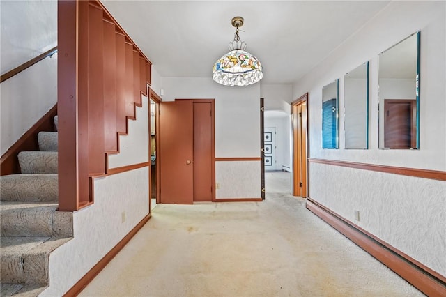 4614 Carroll St, Bloomfield, PA 15224 - hall featuring stairway, carpet floors, and baseboard heating