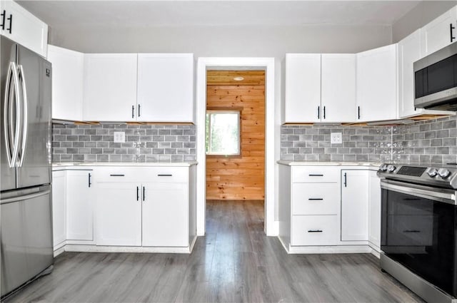 315 Ohio St, Rostraver, PA 15012 - kitchen with appliances with stainless steel finishes, light countertops, and white cabinetry