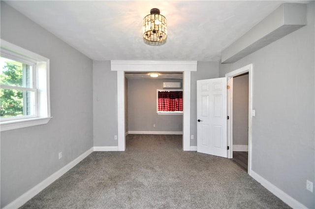 315 Ohio St, Rostraver, PA 15012 - carpeted empty room with a chandelier and an AC wall unit