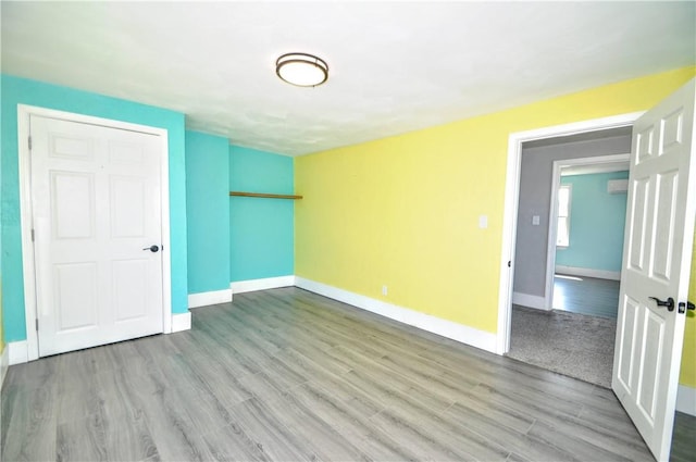 315 Ohio St, Rostraver, PA 15012 - unfurnished room featuring wood finished floors and a wall mounted air conditioner