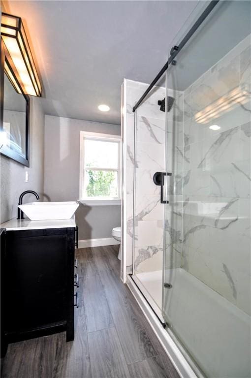 315 Ohio St, Rostraver, PA 15012 - bathroom featuring vanity, a marble finish shower, wood finished floors, and recessed lighting