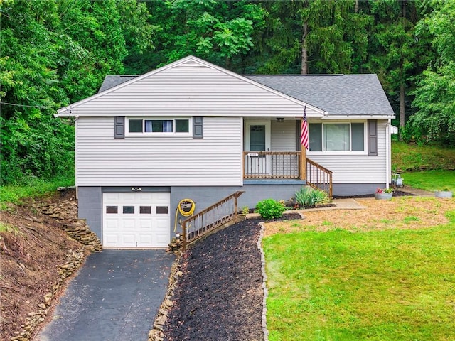 4183 Marion Hill Rd, Daugherty Twp, PA 15066 - ranch-style home with asphalt driveway, a porch, an attached garage, a shingled roof, and a front lawn