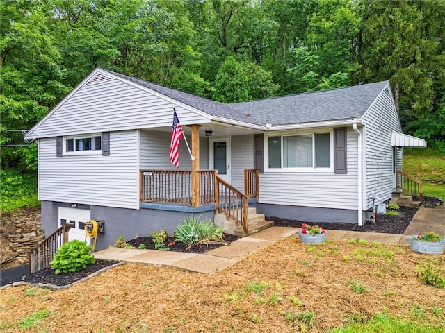 4183 Marion Hill Rd, Daugherty Twp, PA 15066 - view of front facade featuring a shingled roof, a porch, and a garage