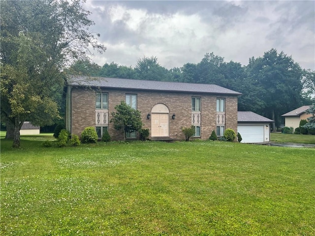 31 Aylesworth Way, Liberty Twp, PA 16127 - raised ranch with brick siding, a front yard, and a detached garage