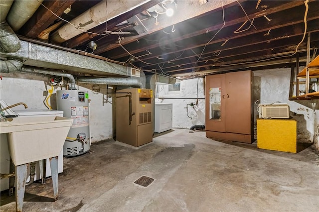 1113 Mary Ann St, South Side, PA 15203 - unfinished basement with water heater, washer / dryer, and heating unit