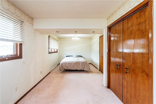 4045 Blue Willow, Hempfield Twp, PA 15642 - bedroom featuring light colored carpet, a baseboard heating unit, a closet, and a chandelier