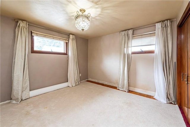 4045 Blue Willow, Hempfield Twp, PA 15642 - empty room with baseboards and a chandelier