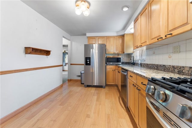 1926 Worcester Dr, Pittsburgh, PA 15243 - kitchen with appliances with stainless steel finishes, light wood-style flooring, decorative backsplash, and stone countertops