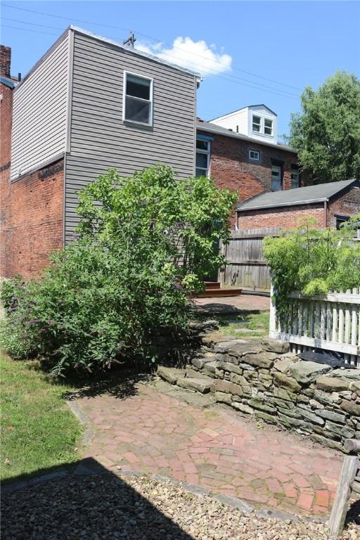 611 Jacksonia St, Central North Side, PA 15212 - back of house featuring brick siding