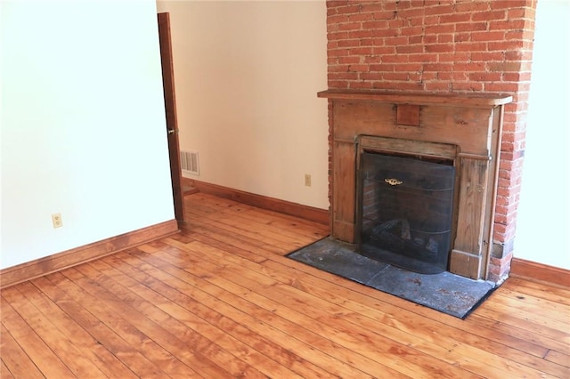 611 Jacksonia St, Central North Side, PA 15212 - detailed view of a fireplace and wood finished floors