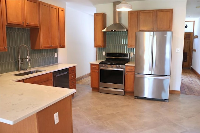 611 Jacksonia St, Central North Side, PA 15212 - kitchen with stainless steel appliances, wall chimney exhaust hood, backsplash, light countertops, and brown cabinetry