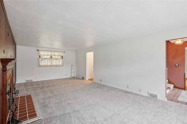 714 Colonial, Washington Twp, PA 15613 - unfurnished living room featuring carpet floors and stairs