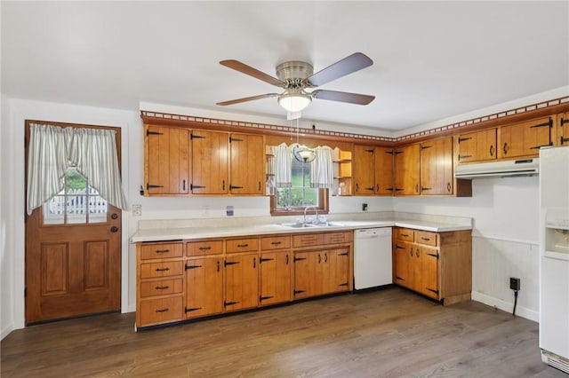 714 Colonial, Washington Twp, PA 15613 - kitchen with light countertops, brown cabinetry, white appliances, ceiling fan, and under cabinet range hood