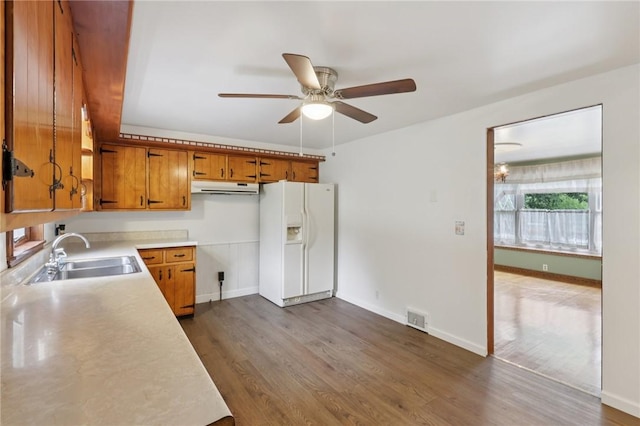 714 Colonial, Washington Twp, PA 15613 - kitchen with white refrigerator with ice dispenser, brown cabinets, a ceiling fan, dark wood-type flooring, and light countertops