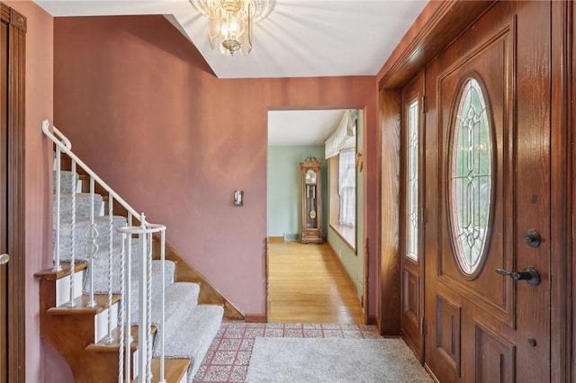 714 Colonial, Washington Twp, PA 15613 - entrance foyer with plenty of natural light, stairway, and light wood finished floors