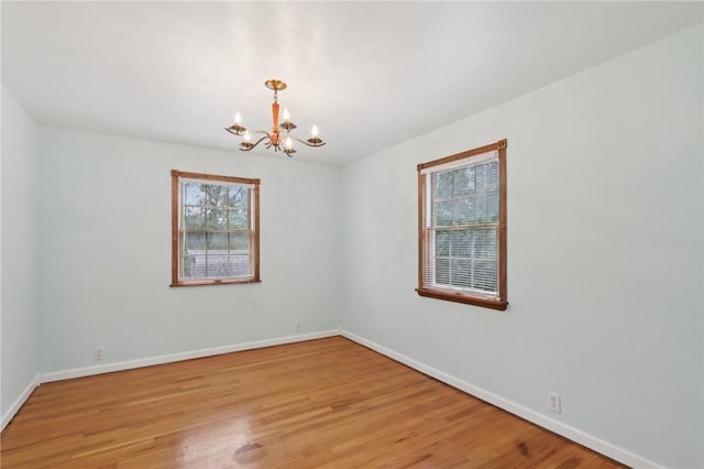 714 Colonial, Washington Twp, PA 15613 - spare room featuring a chandelier and light wood-type flooring