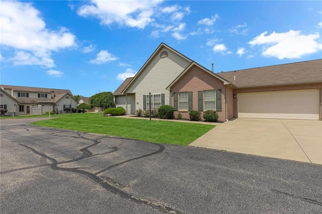 1101 Timberwood, Chippewa Twp, PA 15010 - view of front of home featuring concrete driveway, a garage, brick siding, and a front lawn
